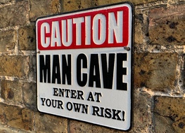 Caution man cave sign